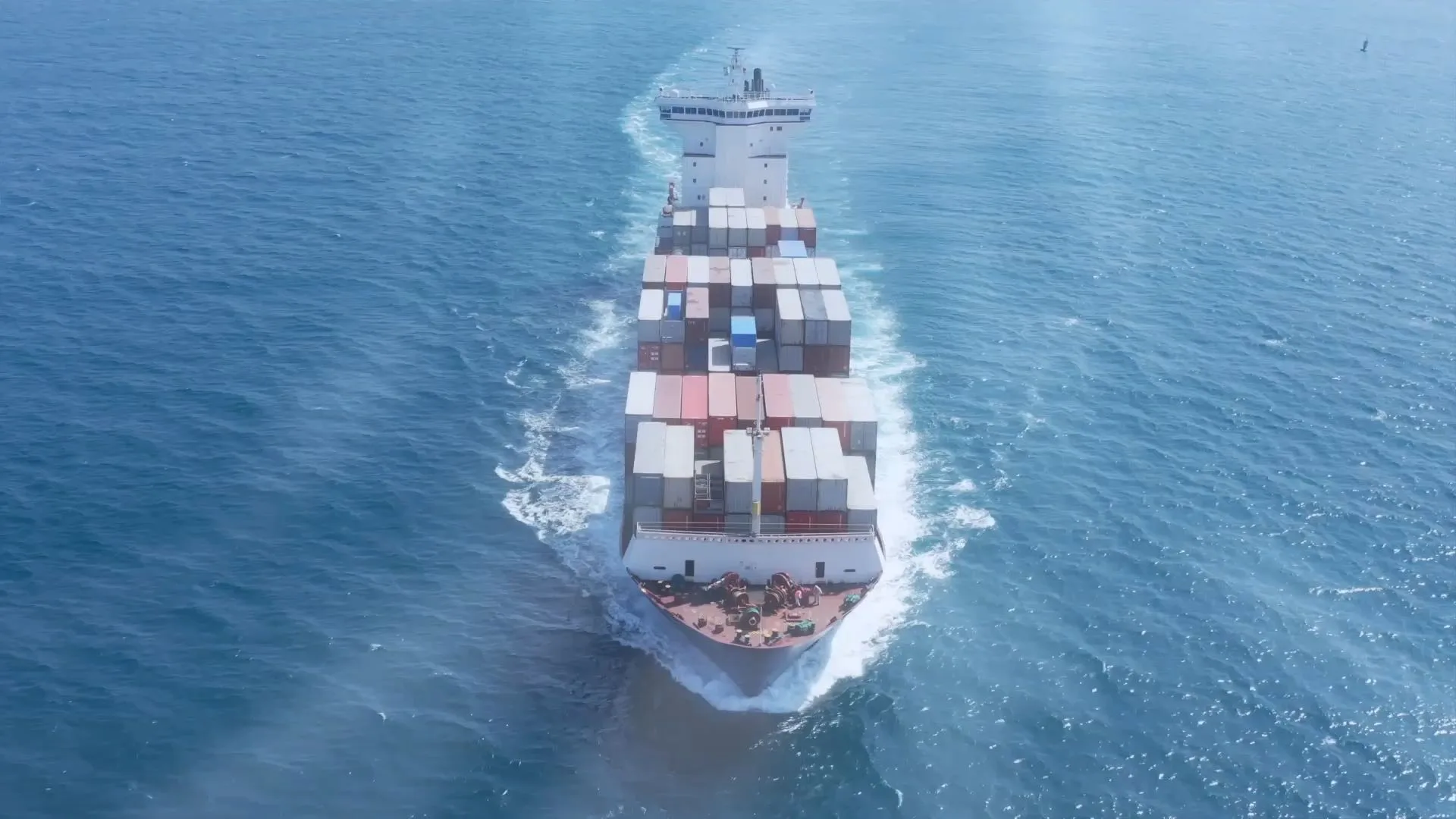 A container ship at sea seen from above